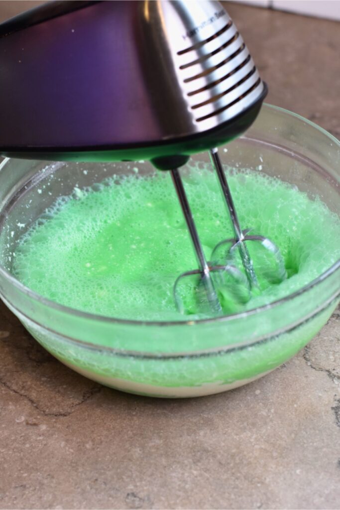 whisk-the-jello-mixture-with-a-hand-mixture Whisk the Jello with a hand mixer until well combined.