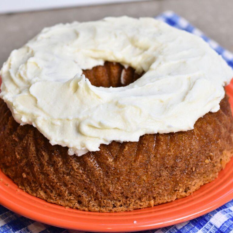 serving carrot bundt cake with cream cheese frosting.