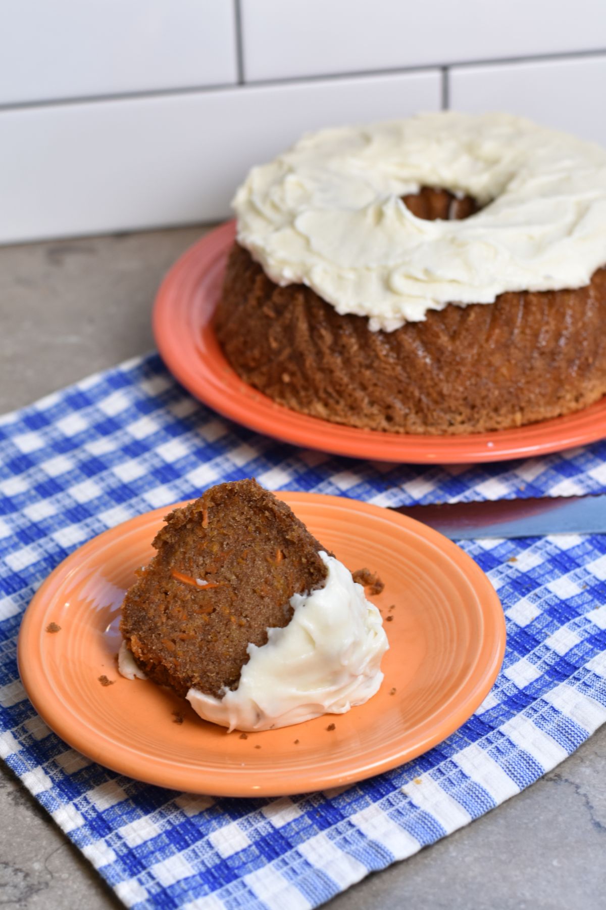 serving a slice of carrot bundt cake.