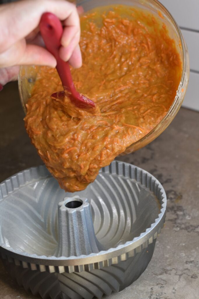 add-the-batter-into-the-bundt-pan Pour the batter into the bundt pan.