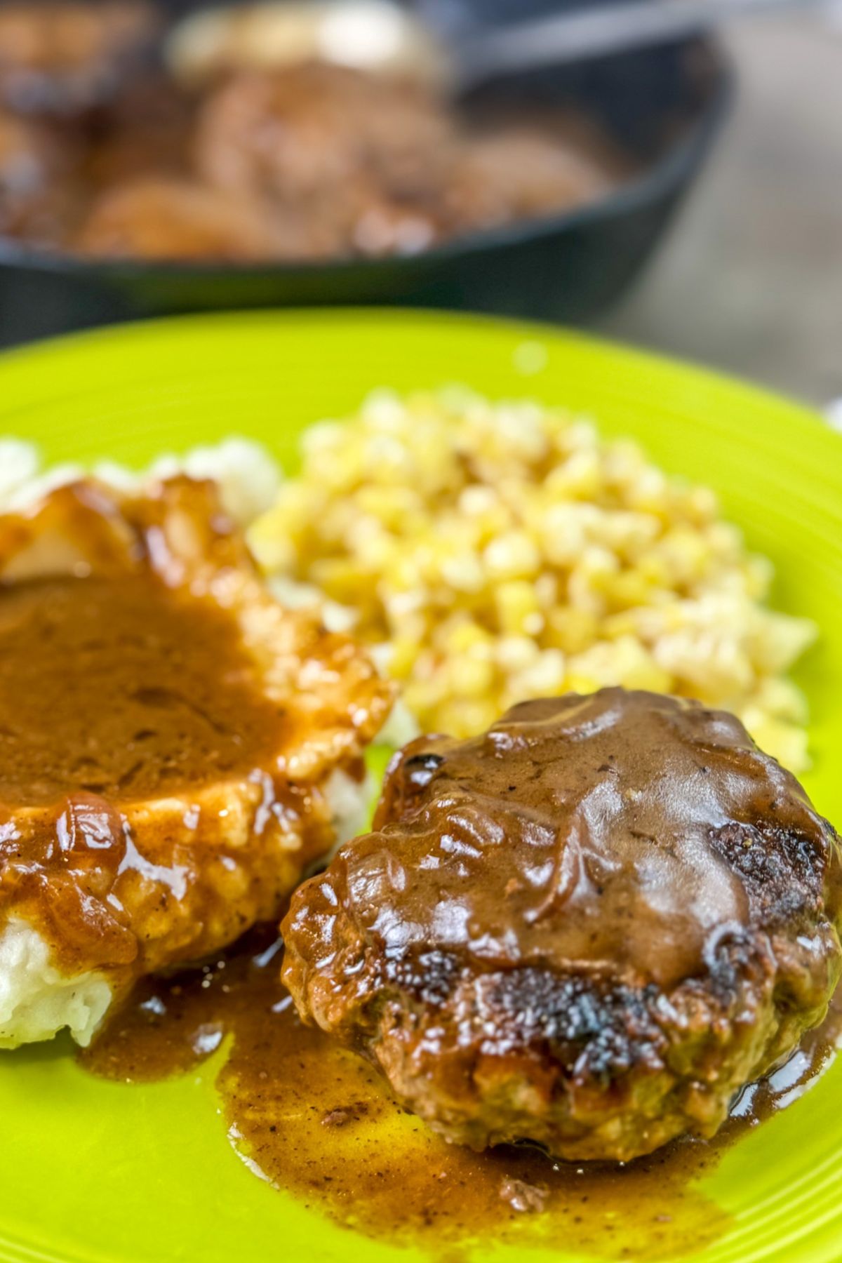 hamburger-steaks-served-with-brown-gravy finished oven-baked hamburger steaks served to guests.