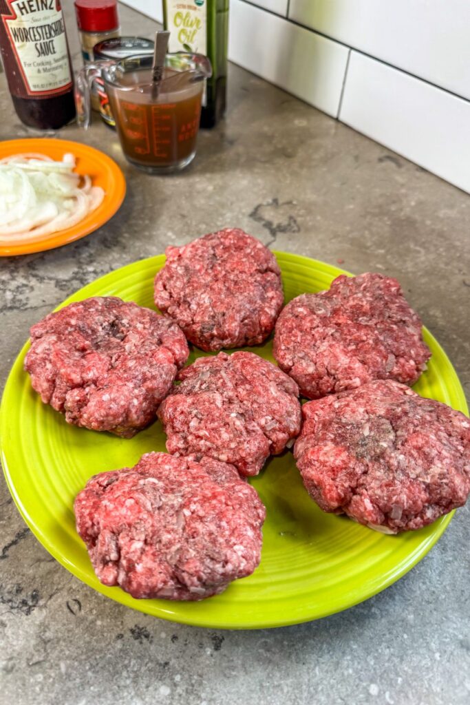 forming-the-patties-for-hamburger-steaks forming the hamburger in steak patties.