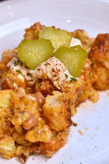 serving the casserole to guest.
