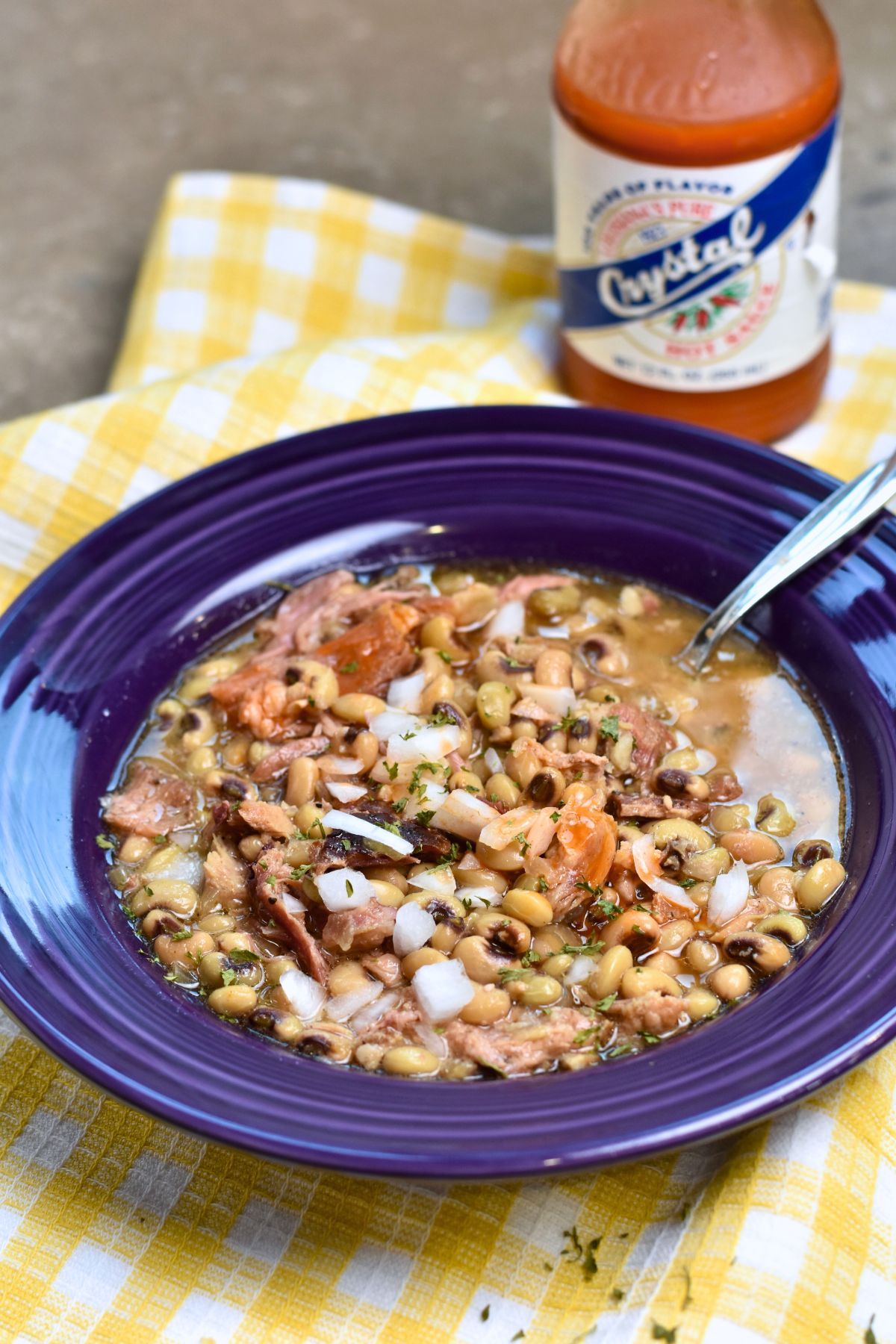serving-peas-to-house-guest Purple hull peas served in a purple bowl.