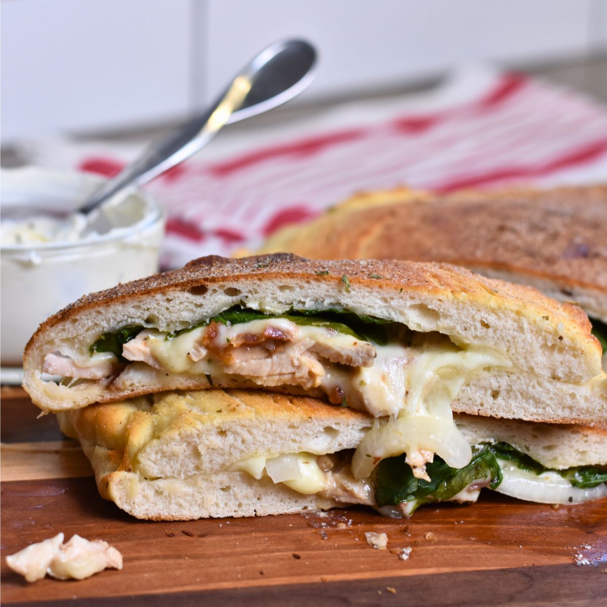 chicken-bacon-ranch-calzone-topped-with-garlic-salt Serving the Chicken Bacon Ranch Calzone with Ranch Dip.