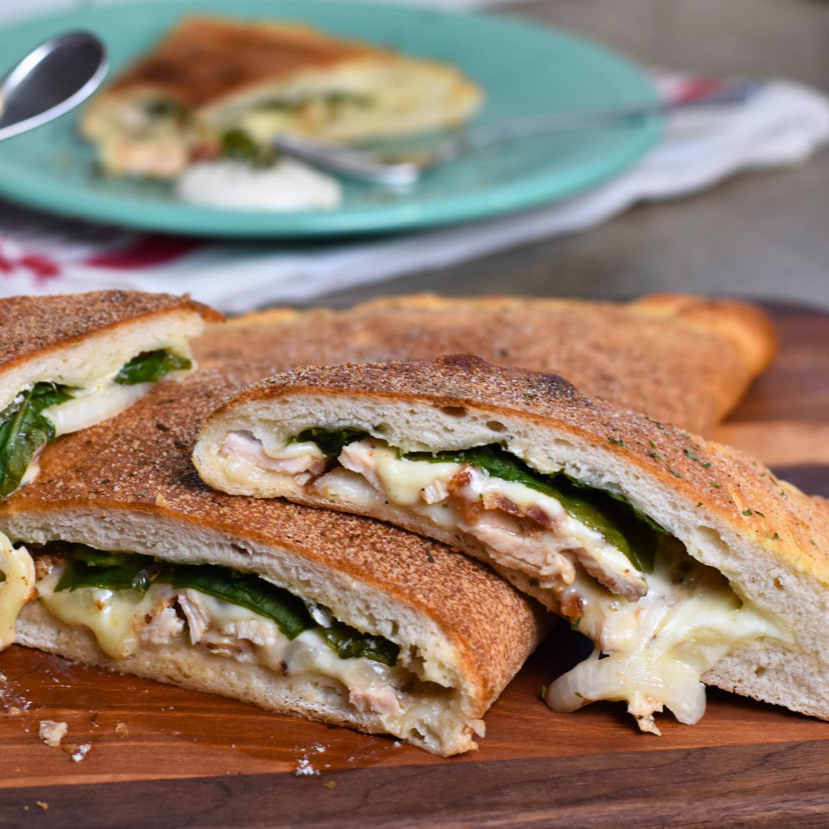 eating-the-chicken-bacon-ranch-calzone serving the chicken calzones to my house guest.