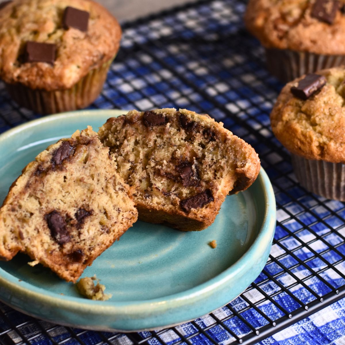 finished banana muffins served on a blue plate.