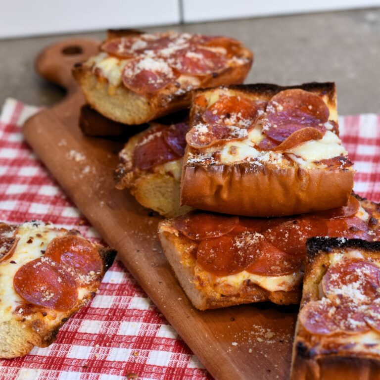 serving the pizza with Parmesan dusted on top.