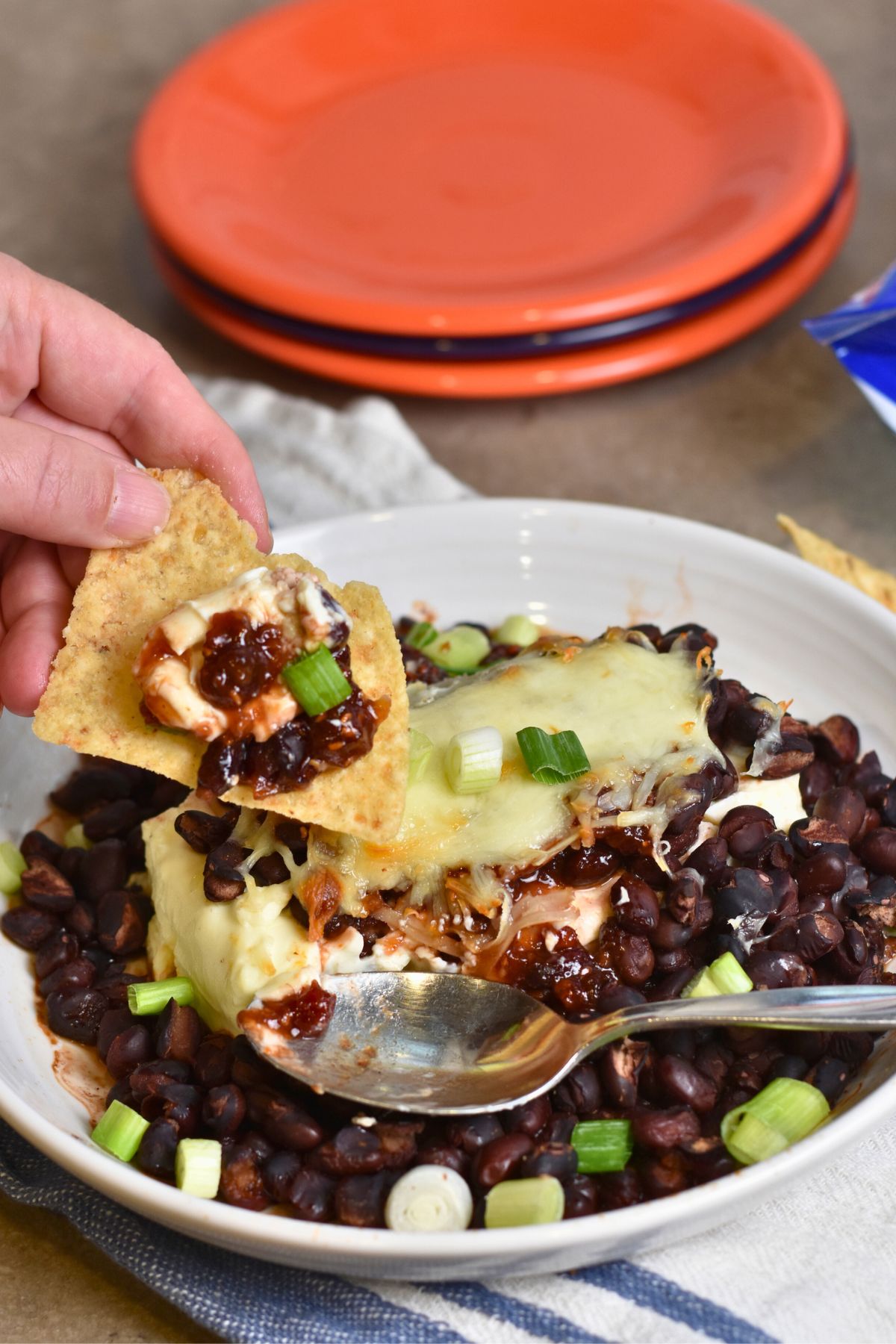 eating the Chipotle dip on a tortilla chip.