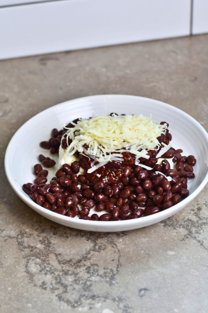 Top the raspberry cream cheese with mozzarella.