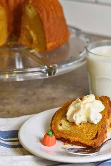 slicing the cake and serving it on a white plate.