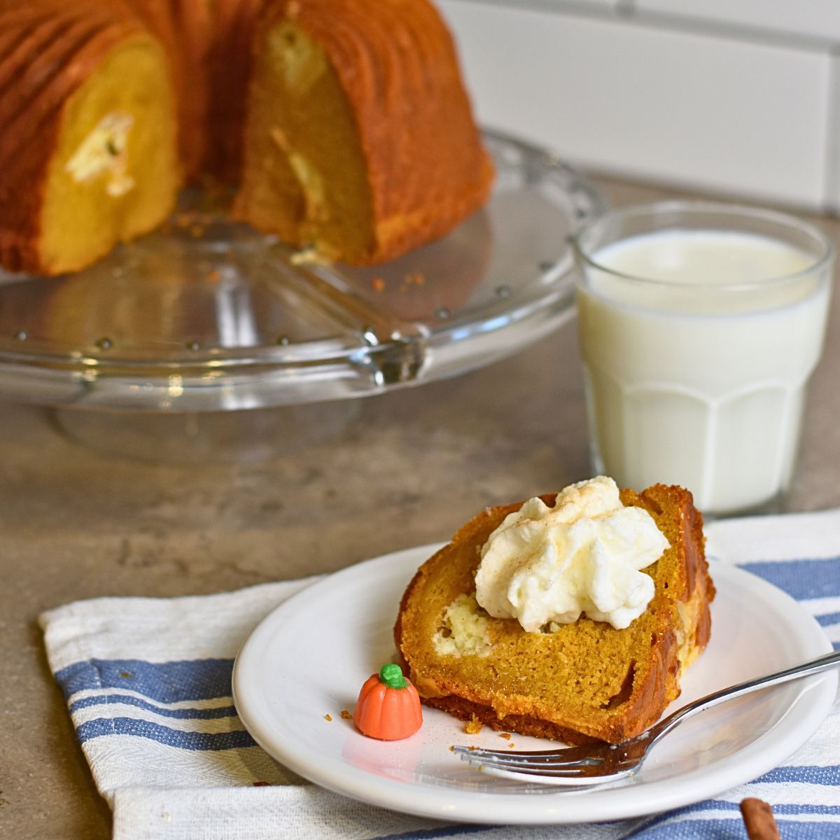 slicing the cake and serving it on a white plate.