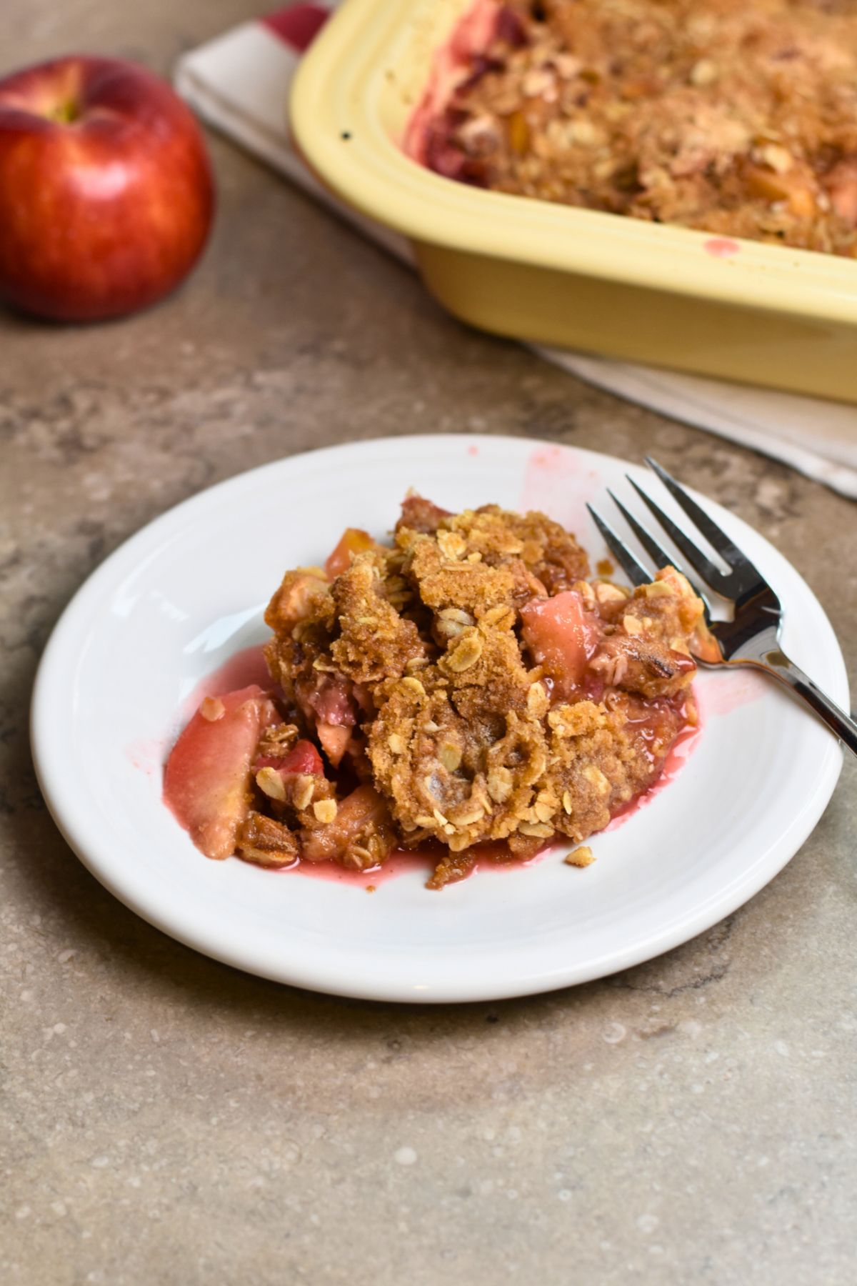 Serving the cherry and apple golden crumble.