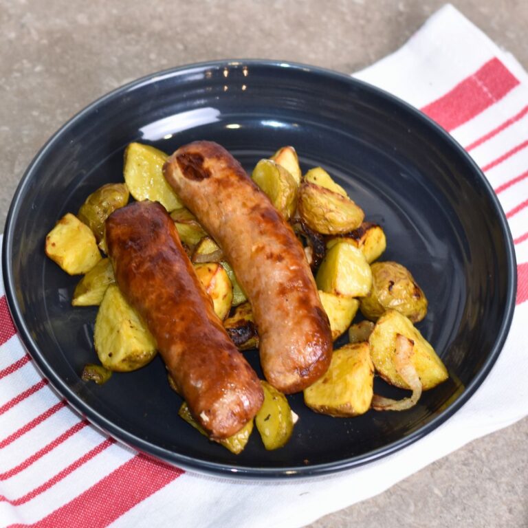 serving the brats with a bed of potatoes.