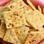 Cajun Crackers with flakes of red pepper on each cracker.
