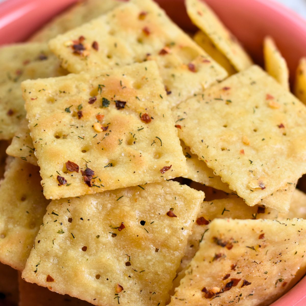 Ready-to-eat-cajun-crackers Cajun Crackers with flakes of red pepper on each cracker.