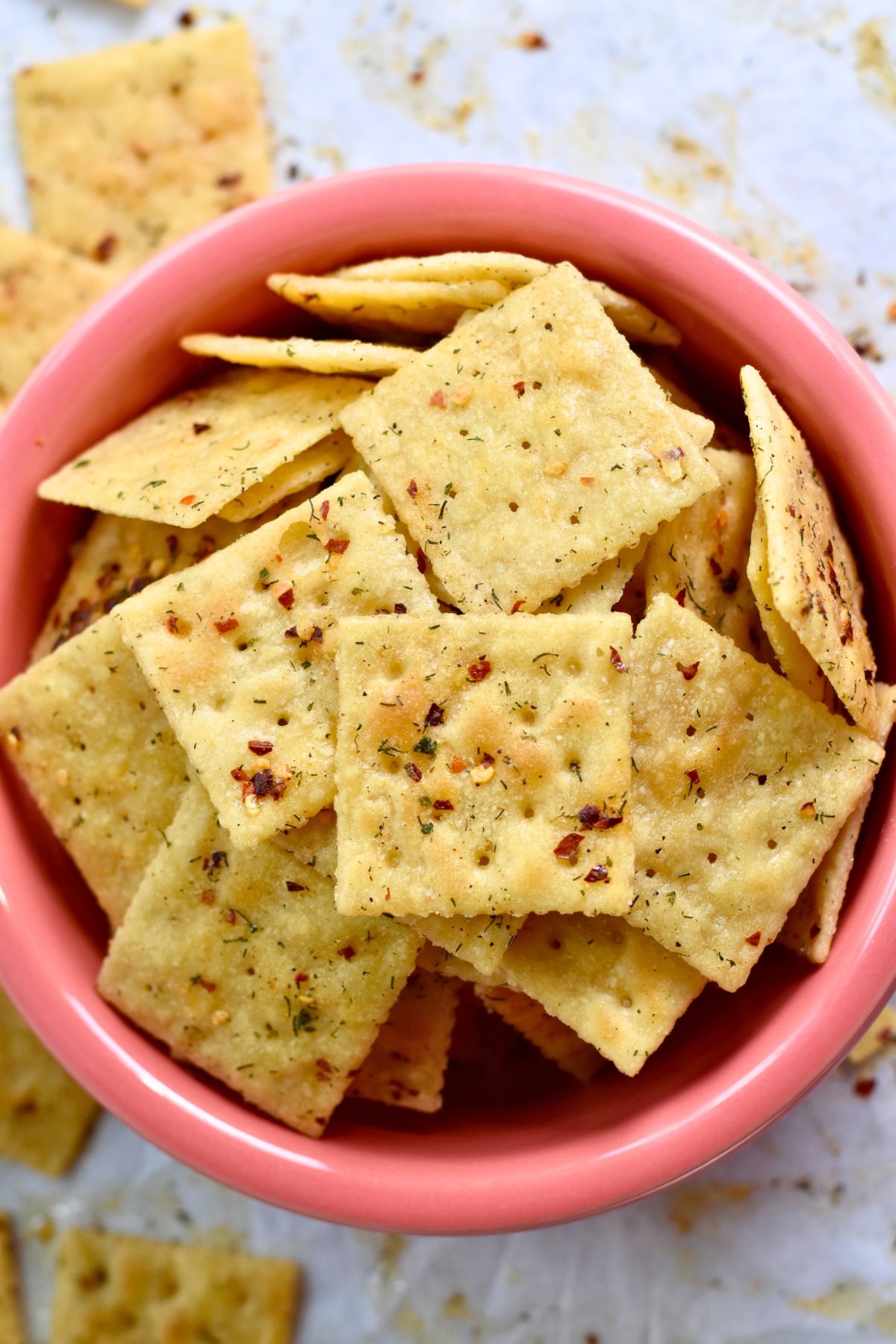 Serving-the-crackers-to-my-house-guest Serving the Cajun Crackers in a pink bowl.
