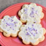 Sugar cookies with cream cheese frosting, perfect for an occasion.