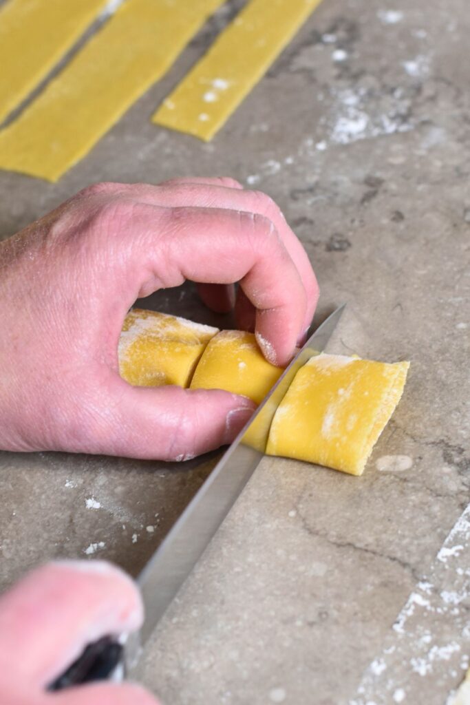 cut-the-strips-into-three Cutting the pappardelle noodles into strips.
