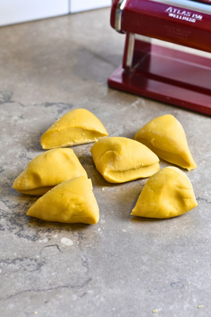 Cut-the-dough-into-six-pieces Cut the dough into 6 pieces to begin flattening.