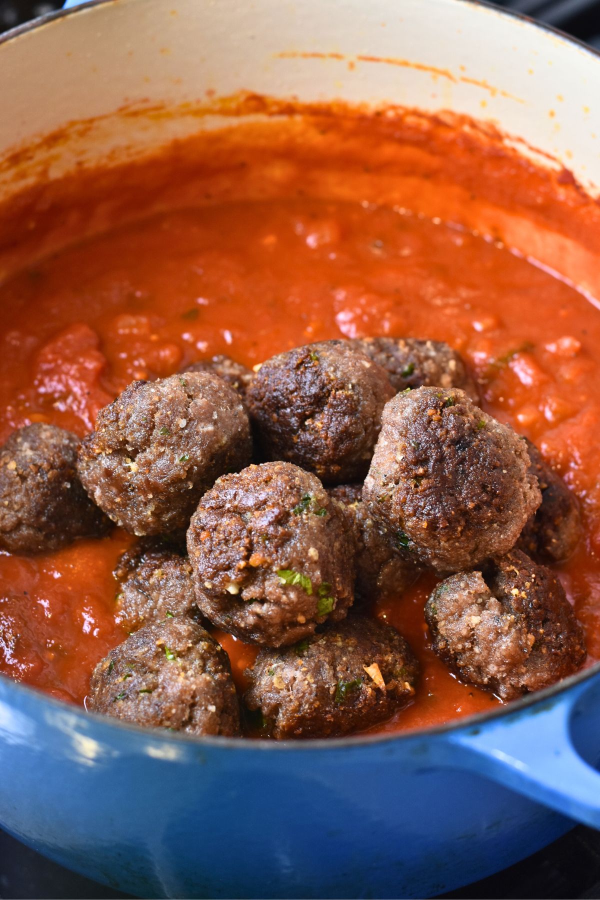 Cooking-the-homemade-italian-red-sauce Add the homemade meatballs to the red sauce and cook until they are done.
