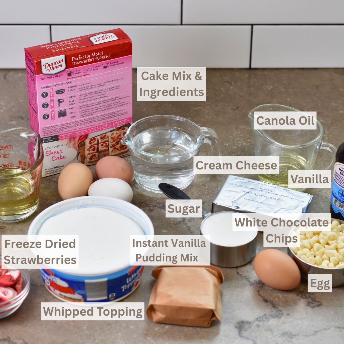 Ingredients-for-making-strawberry-cake-with-filling Ingredients for strawberry cake with cream cheese filling.