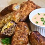 Ready-to-eat cheeseburger spring rolls.