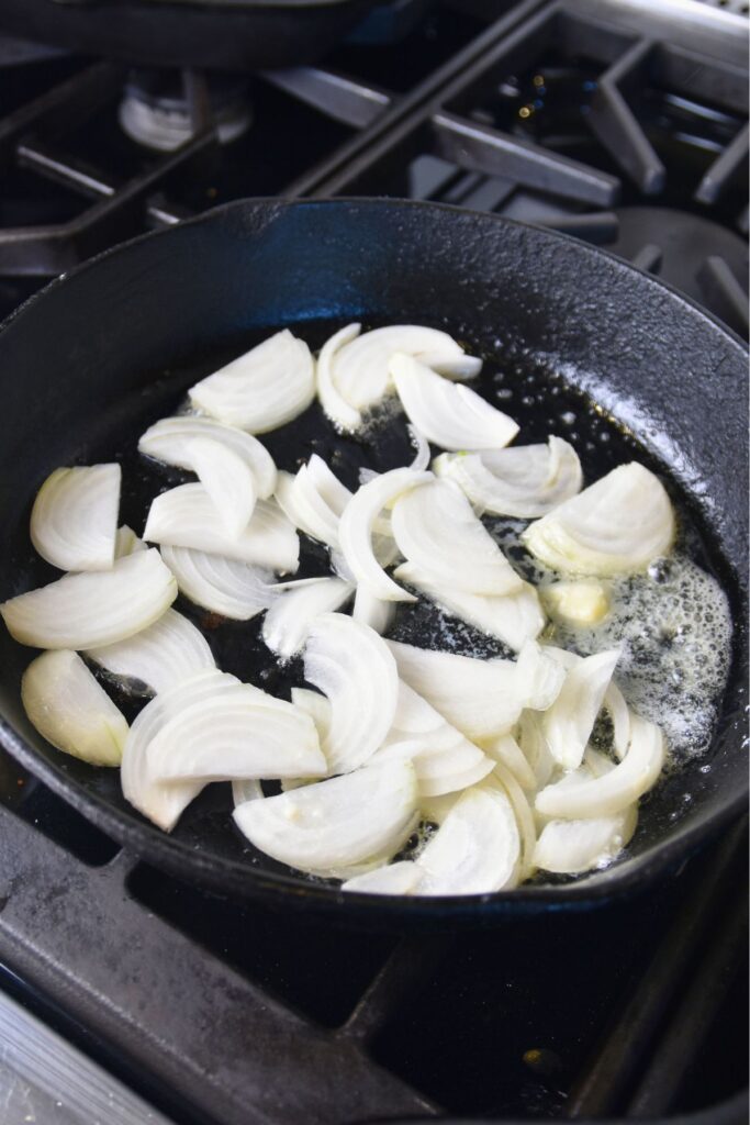 grill-the-onions-in-a-cast-iron-skillet Grill the onions in a cast-iron skillet.