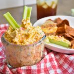 ready-to-eat jalapeno pimento cheese being served in a glass bowl.