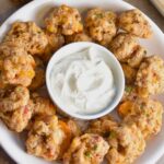 Serving pimento cheese sausage balls with ranch.
