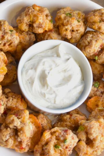 Serving pimento cheese sausage balls with ranch.