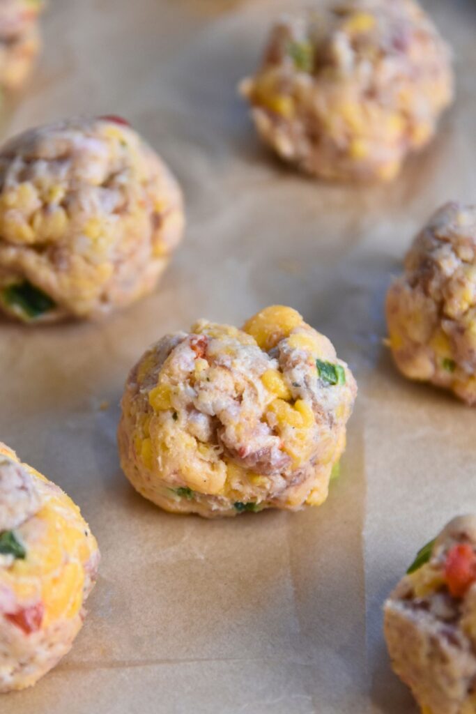 form-the-sausage-mixture-into-balls Place the pimento cheese sausage balls into the oven.