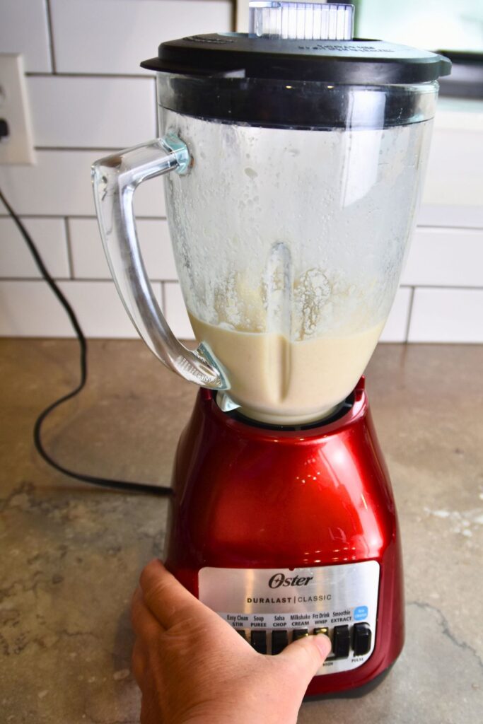 blending-the-pineapple-mixture Blend the pineapple slushy until creamy.