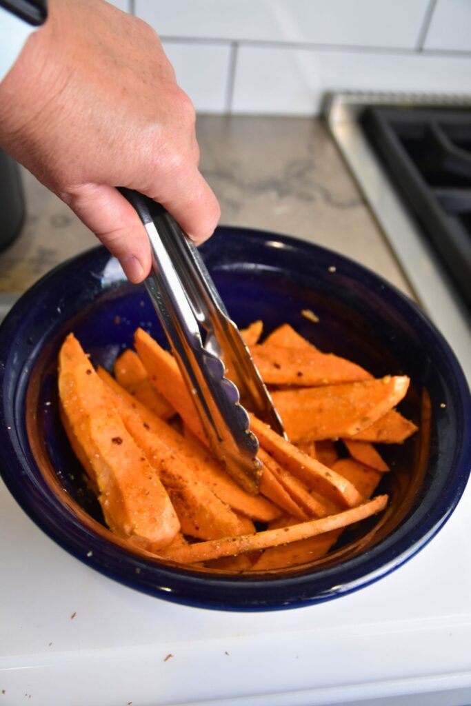 sweet-potato-fries-ready-to-into-the-air-fryer Cover the sweet potatoes in olive oil and the seasoning mix.