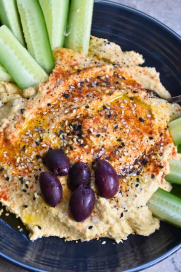 Serving hummus with cucumbers.