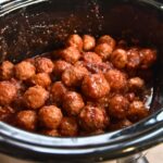 Saucy cranberry meatballs served in the crock-pot.