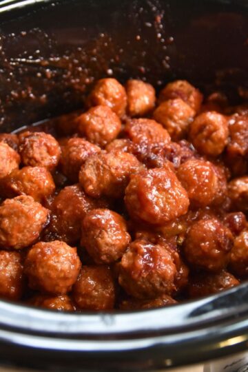Saucy cranberry meatballs served in the crock-pot.