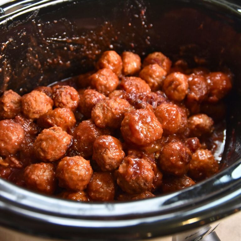Saucy cranberry meatballs served in the crock-pot.