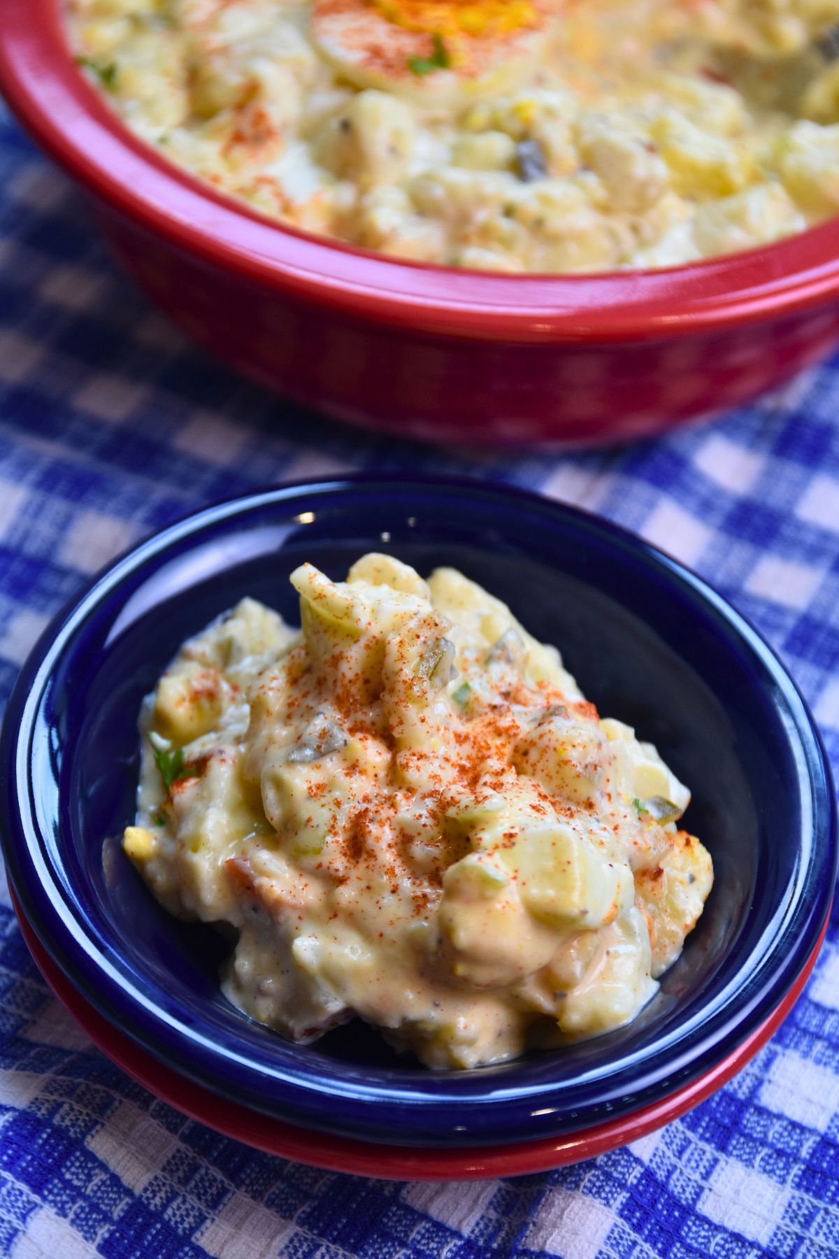 single-serving-of-red-potato-salad Serving the potato salad in a blue bowl.