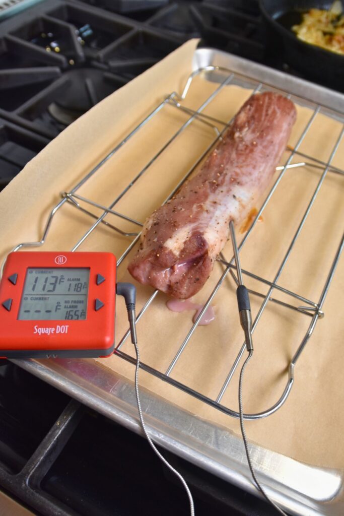 Cook-the-pork-tenderloin-until-it-reaches-120-degrees Insert the thermometer into the pork tenderloin.