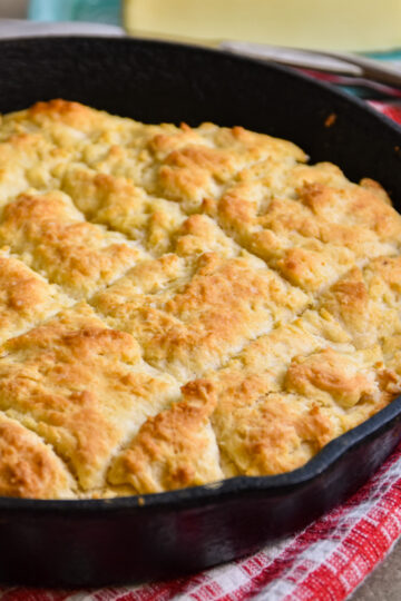 Biscuits in a black iron skillet.