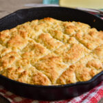 Iron skillet full of golden biscuits