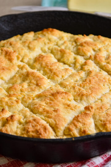 Iron skillet full of golden biscuits