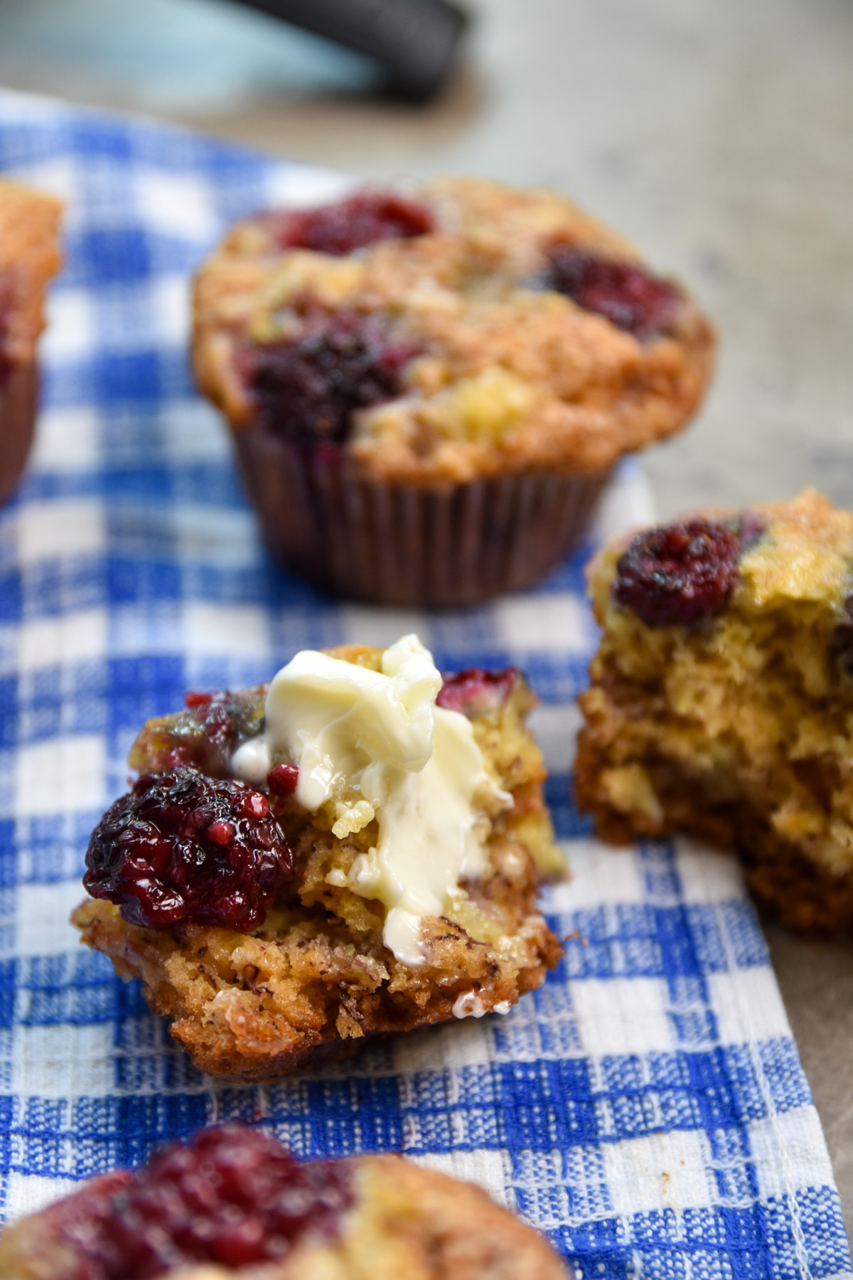 blackberry banana muffin bite with butter smeared
