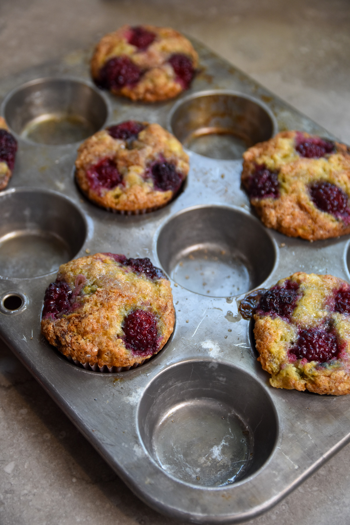 baked blackberry banana muffins in muffin pan