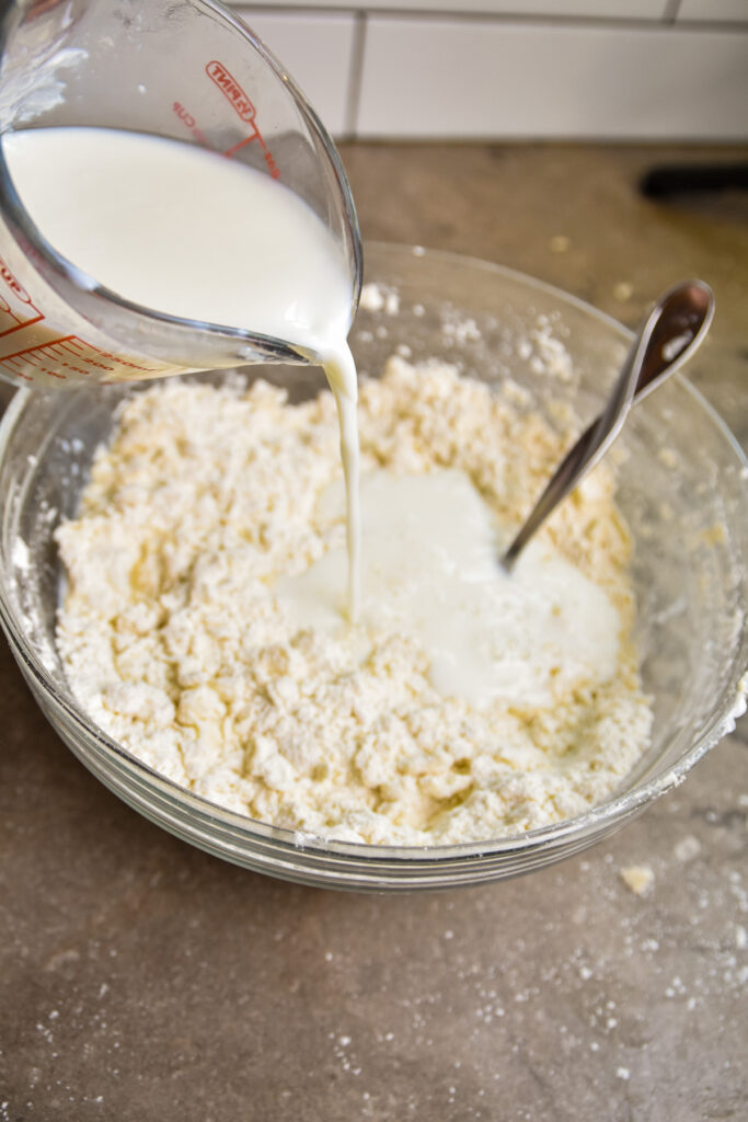 add-buttermilk-to-biscuits Adding milk to dry ingredients of skillet biscuits