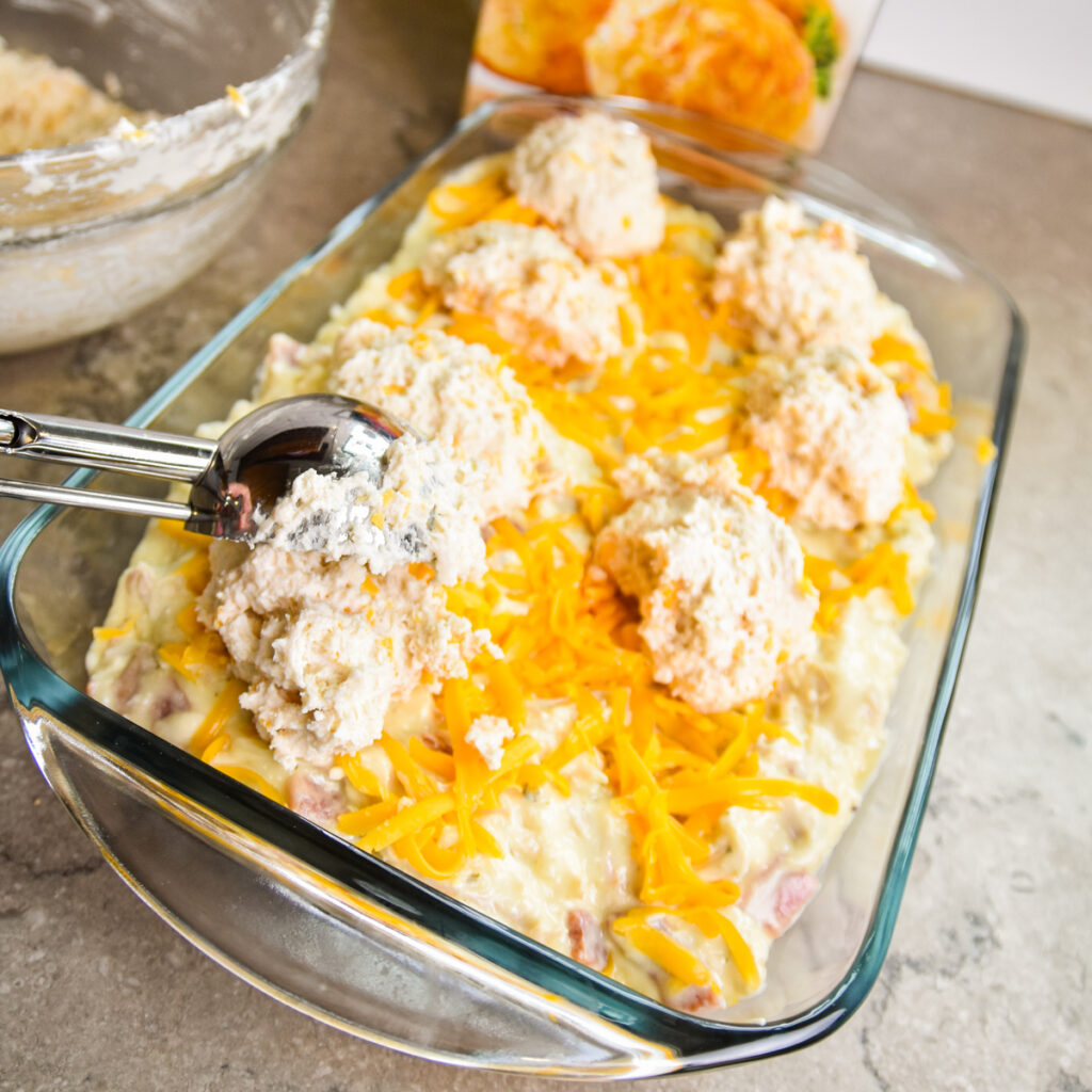 Scoop biscuit dough on top of chicken mixture.