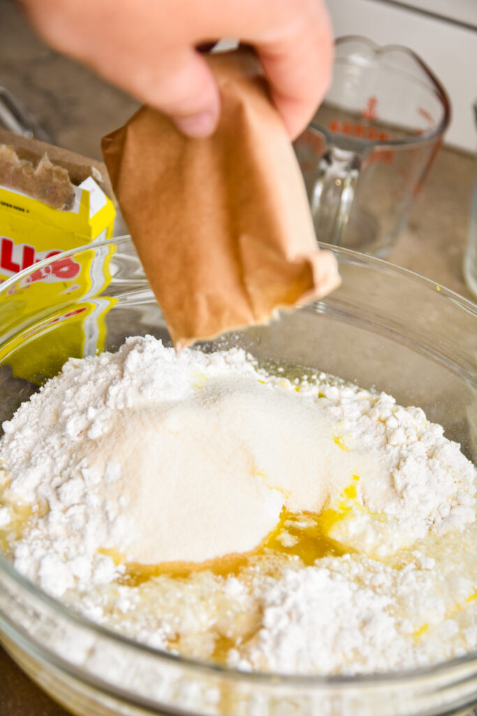 Adding lemon jello to cake mix.