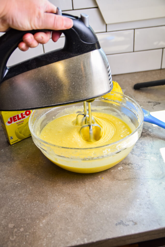 Mixing lemon jello cake batter.
