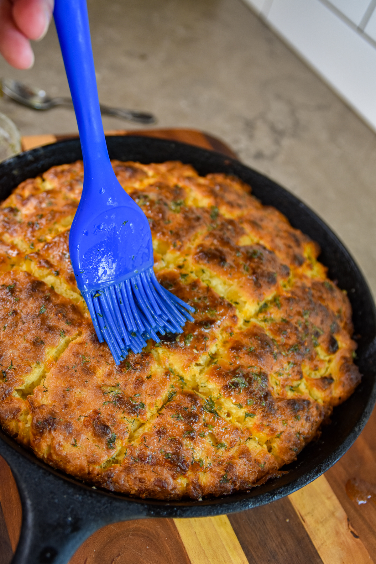 Ironn skillet of golden cheddar bay biscuits.